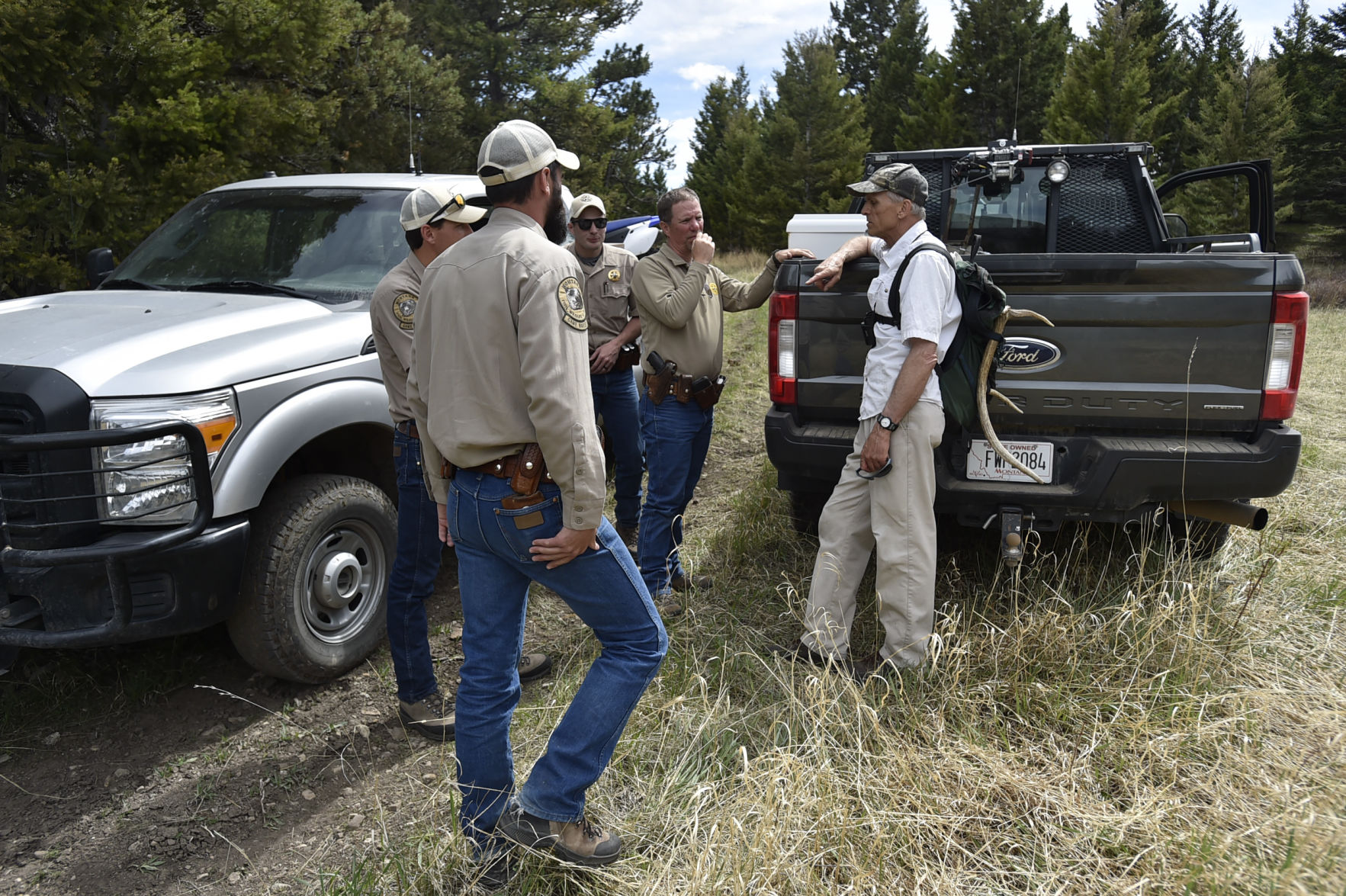 Montana Fish, Wildlife and Park game wardens chat with a shed hunter Wednesday